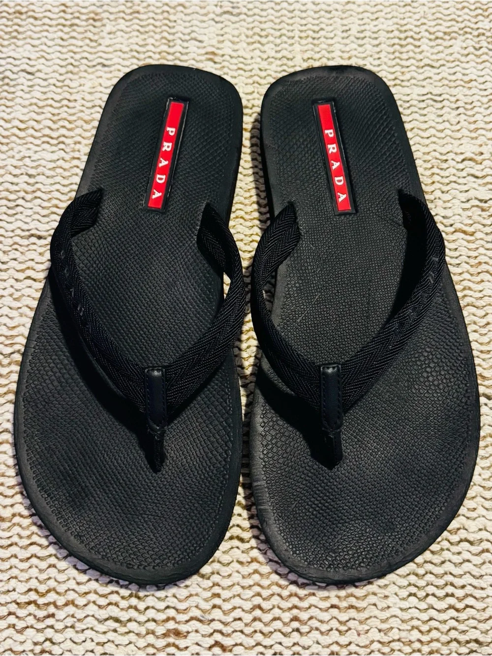 Prada Black Flip-Flop Sandals with Red Logo Accents